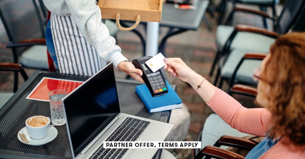 20250715 social disclaimer parter offer terms apply waitress holding credt card reader for customer.jpeg