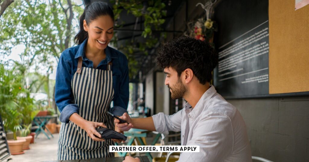 Chase Freedom Limitless assessment: Complete main points social image partner offer terms apply man making a contacless payment at a restaurant using his cel.jpeg