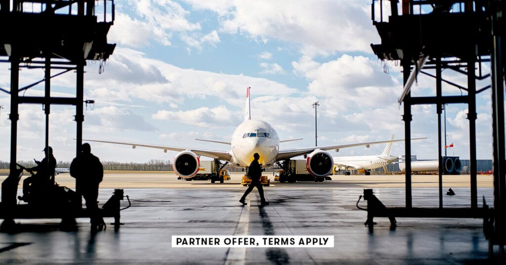 20250715 social disclaimer parter offer terms apply workers walking around plane in aircraft hanger.jpeg