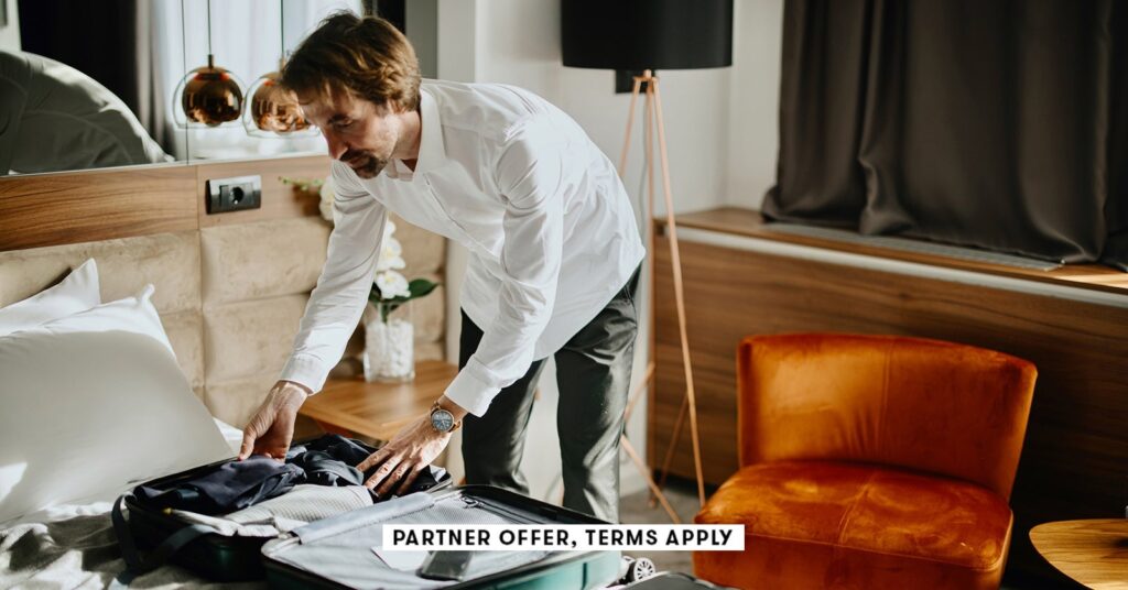 social image partner offer terms apply business traveler packing up suitcase in hotel anchiy social.jpeg