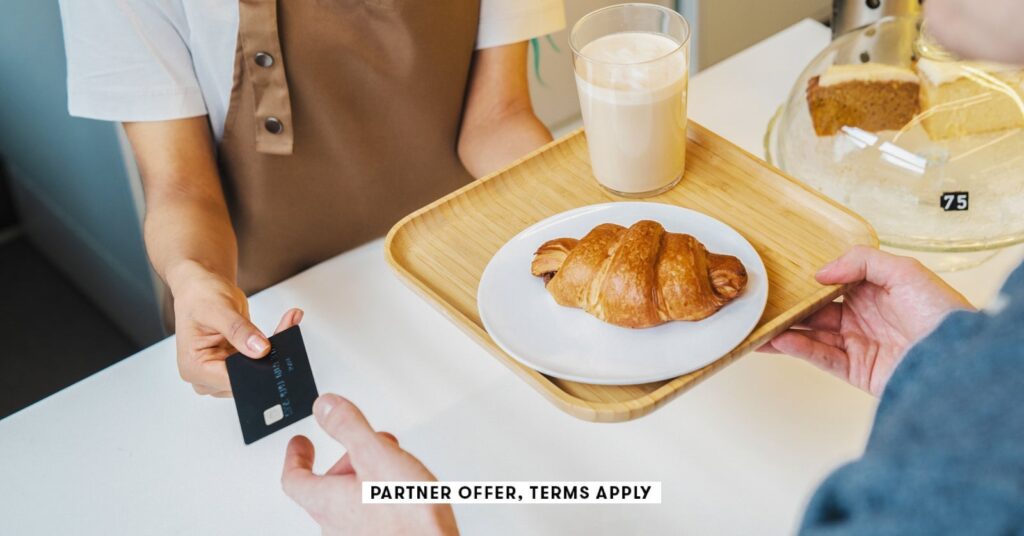 social image partner offer terms apply customer paying for his order with a credit card in a cafe i.jpeg