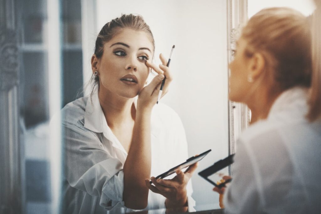 Must You Purchase e.l.f. Inventory Earlier than Would possibly 20? urlhttps3a2f2fg.foolcdn.com2feditorial2fimages2f8697472fperson in front of mirror putting o.jpeg
