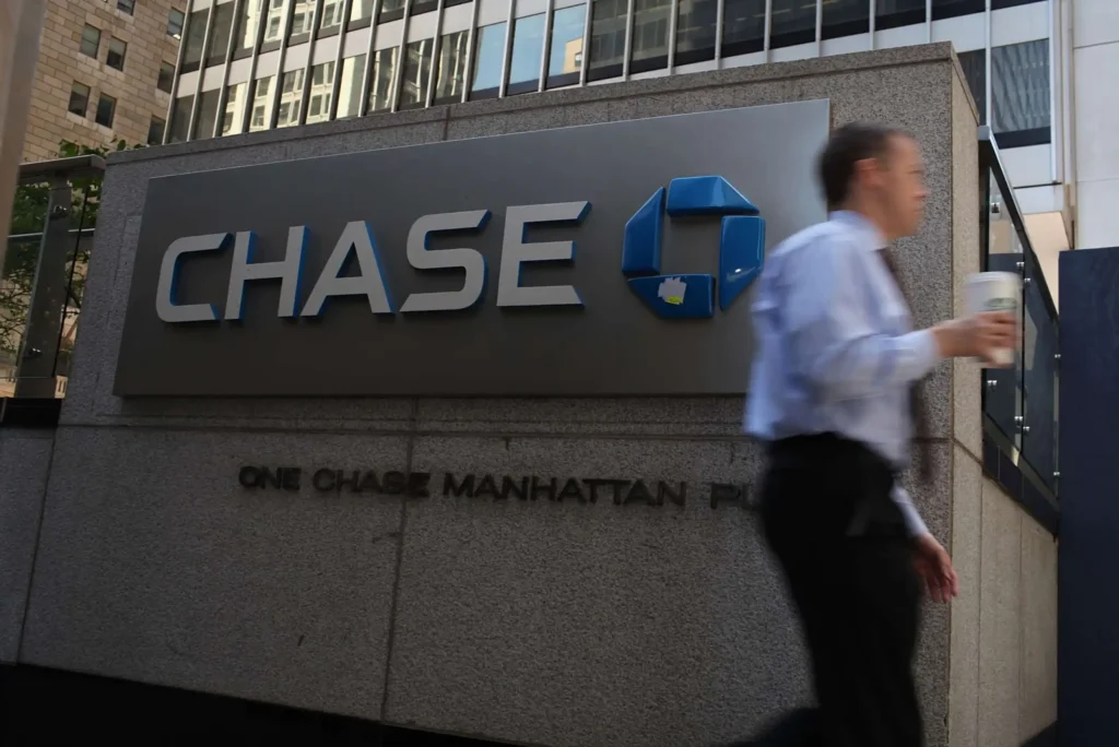 man walking chase bank sign scaled.webp.webp