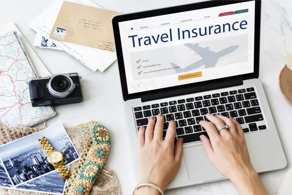 travel insurance woman computer policy desk vacation camera.webp.webp